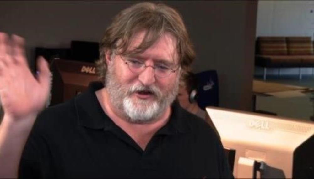 Gabe newell showing excitement with three fingers raised